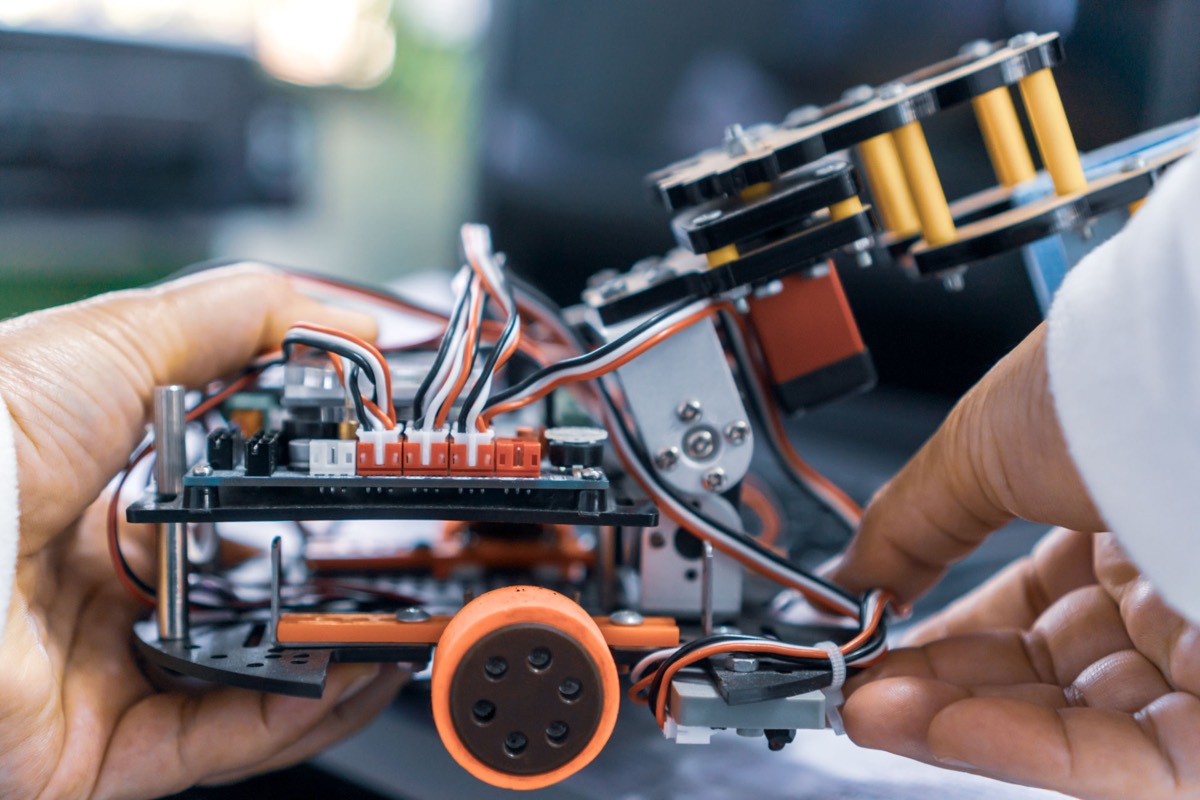 Engineer assembling a robotics prototype
